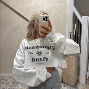 Revolve LA Champagne Gang NY Jumper in Pebble Heather